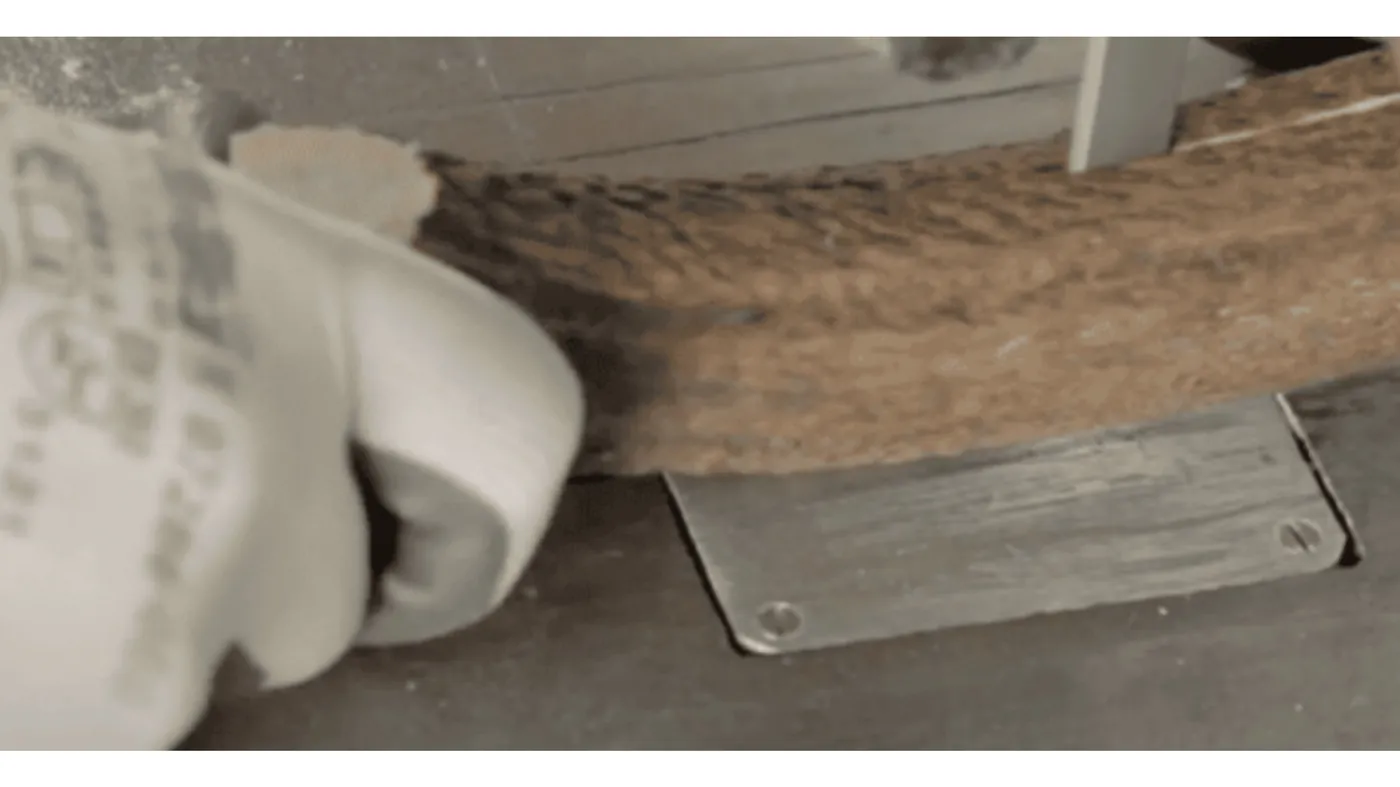 An antler being cut with a saw in the workshop